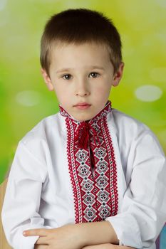 Belarusian little boy in embroidered. Ukrainian child in an embroidered national shirt. Portrait of a Slavic boy