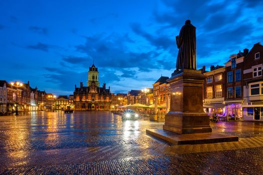 Delft City Hall and Delft Market Square Markt with Hugo de Groot Monument in the evening. Delfth, Netherlands
