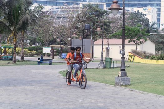 Boys On The Bicycle At the Park inside Eco tourism park Kolkata India South Asia March 22, 2022