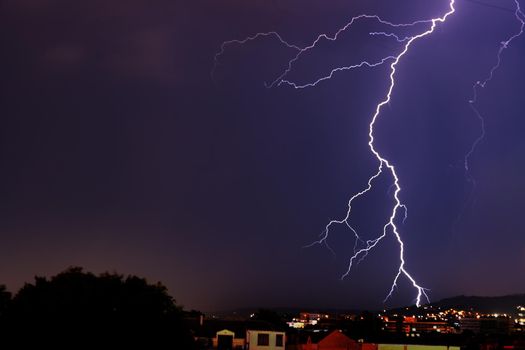 Exciting powerful lightning over the city, zipper, and thunderstorm