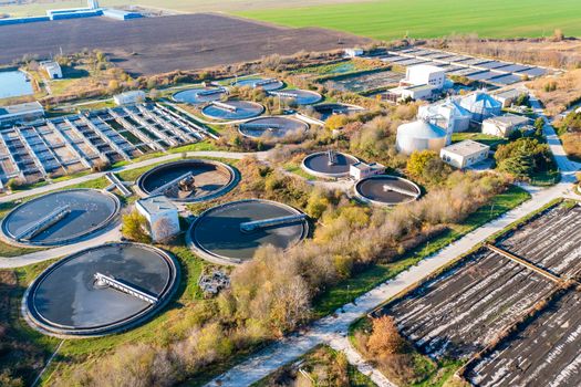 Aerial top view of a city sewage treatment plant.