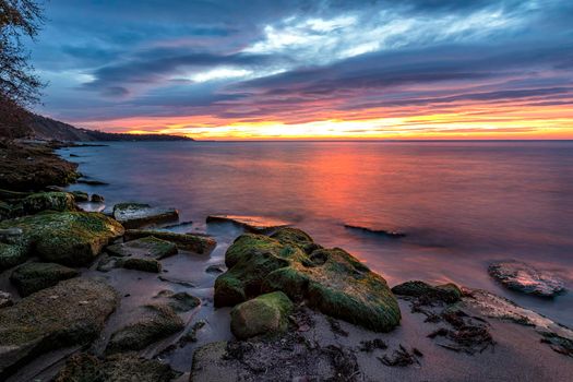 Exciting long exposure sunrise over the sea.