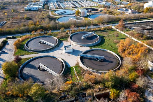 Aerial top view of a city sewage treatment plant. A group from the big sedimentation drainage.