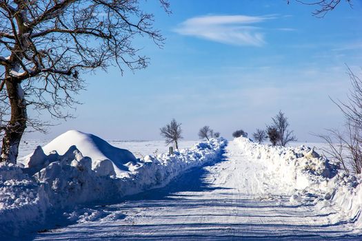 snow-covered road in the winter landscape