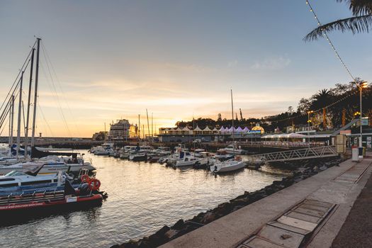 Funchal, Madeira, Portugal - December 31, 2021: View of Funchal marina where people gather in the evening to watch the new year fireworks