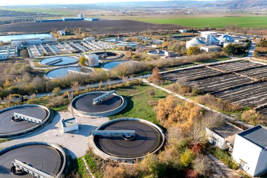 Aerial top view of a city sewage treatment plant.