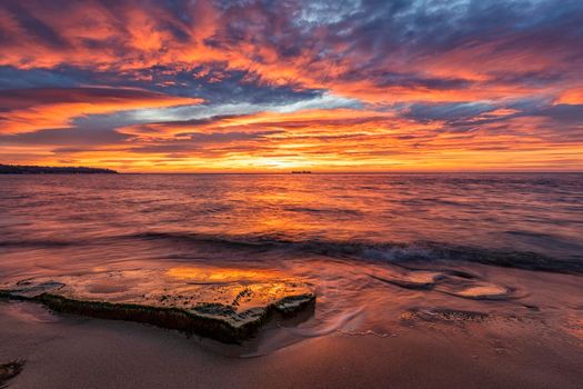 Amazing red sunrise over the sea.