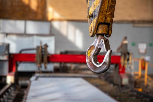 Crane clevis sling hook in an industrial factory. Horizontal view.