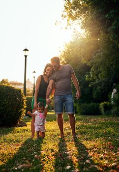 Shot of a young family outdoors.