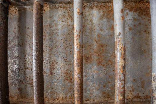 Rusted old iron bars designed to reinforce a door.