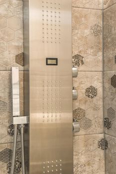 Modern shower system with patterned tiles in a modern house