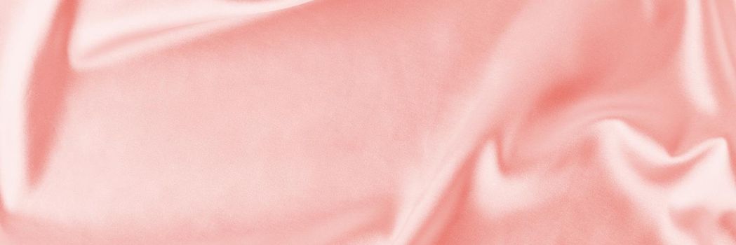Light pink silk background with folds. Abstract texture of rippled satin surface, long banner