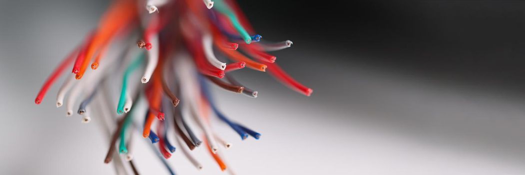 Close-up of large group of copper wires, electric screened power cables, colourful wires used in telecommunication, connect internet access. Electricity concept. Blurred background