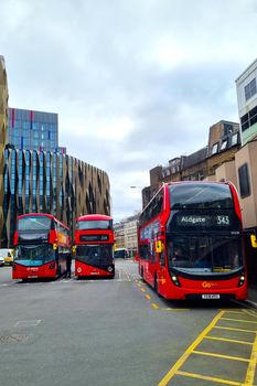 London, United Kingdom, February 4, 2022: bus station with red double-decker buses. Public transport