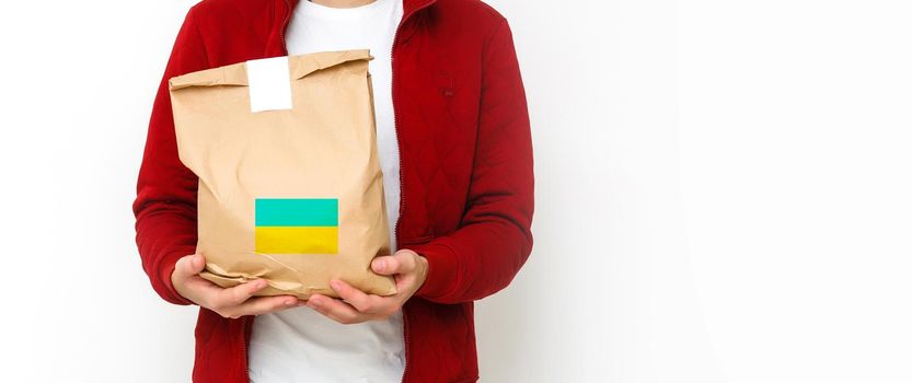 a man holds a box with humanitarian aid to ukraine.