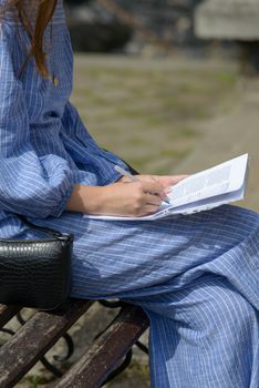 Female hand with pen completing personal information on form. Business woman signing profitable contract.