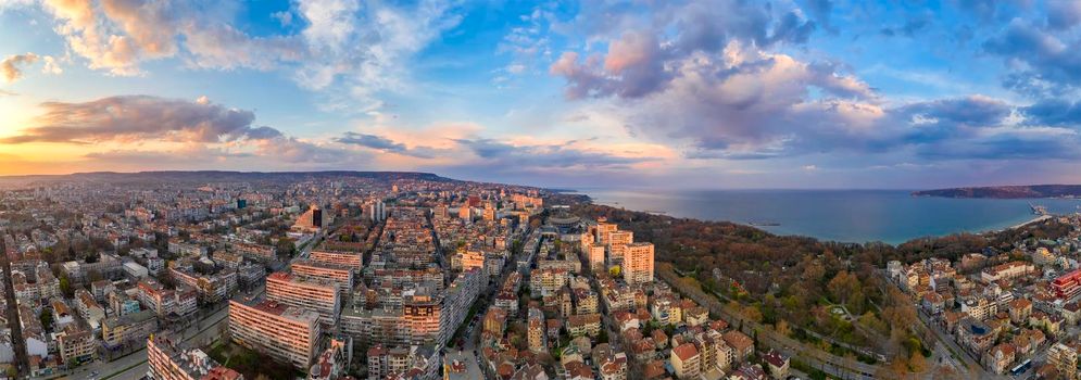 Stunning aerial panoramic view of the sky with colorful clouds over the city of Varna, Bulgaria.