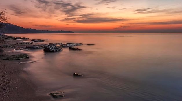 Awakening. An incredible feeling at the beach of the sea in anticipation of sunrise