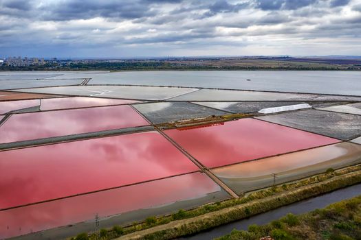 Aerial view of colorful salt pans near the sea