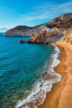 Agios Ioannis greek beach and Aegean sea on sunset. Milos island, Greece