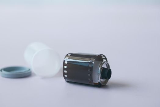 close up of camera with film rolls on table .
