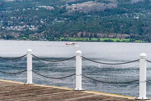 Hydro airplane preparing to take off Okanagan lake surface.