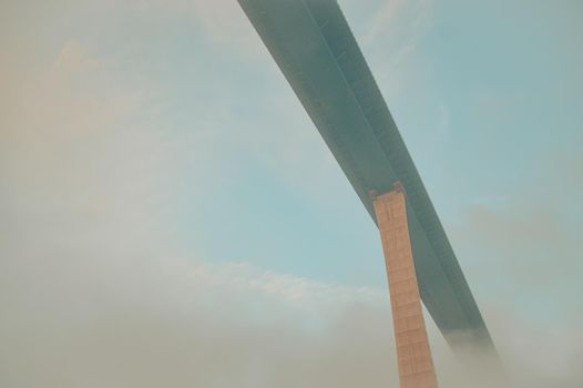 Low angle view of a bridge hidden in the fog