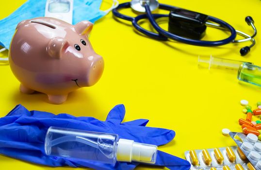 medicines, pills, mask, virus on a yellow background covid