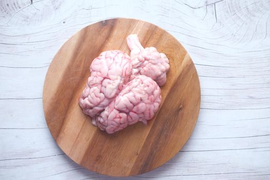 close up of mutton brain on a chopping board .