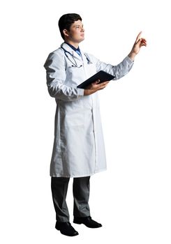 Doctor in a medical gown holds a tablet and touches something in front of him
