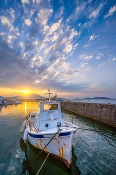Old fishing boat in port of Naousa on sunset. Paros lsland, Greece