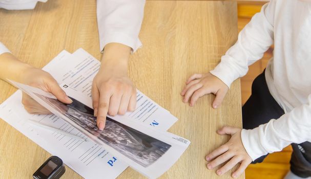 child being checked by a doctor. Selective focus