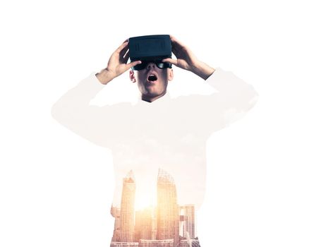 Young man with virtual reality headset or 3d glasses over cityscape background