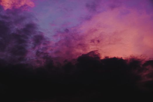 Dramatic colorful clouds in the sky during sunset that resembles watercolors in a canvass