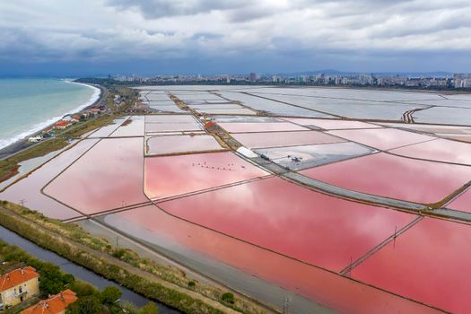 Aerial view of colorful salt pans near the sea. Burgas, Bulgaria