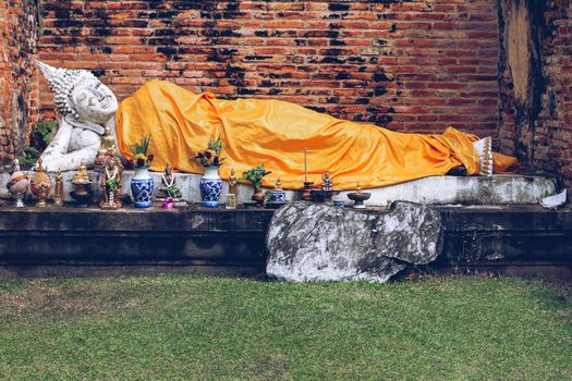 Reclining Buddha statue in Wat Yai Chai Mongkhol inside Ayutthaya Historical Park in Thailand