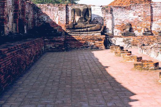 Remnants of the ancient ruins of Wat Chaiwatthanaram, part of the famous Ayutthaya Historical Park in Thailand