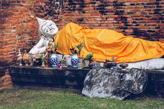 Reclining Buddha statue in Wat Yai Chai Mongkhol inside Ayutthaya Historical Park in Thailand