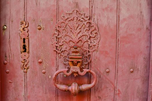 vintage keyhole in a old wood red door