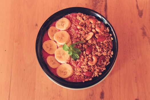 Healthy vegan smoothie bowl for breakfast following the current diet fads and food trends of a more sustainable living