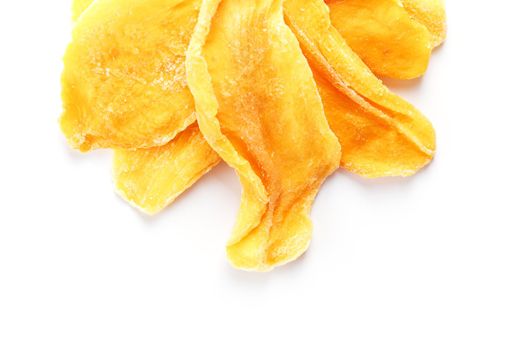 Dried sweet mango fruit slices as textural orange background in full screen