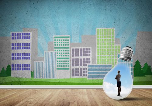 Businesswoman inside light bulb against city drawn concept