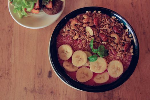 Healthy vegan smoothie bowl for breakfast following the current diet fads and food trends of a more sustainable living