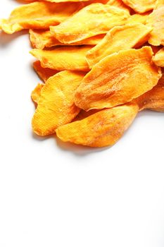 Ripe dried mango sliced on a white background with free space