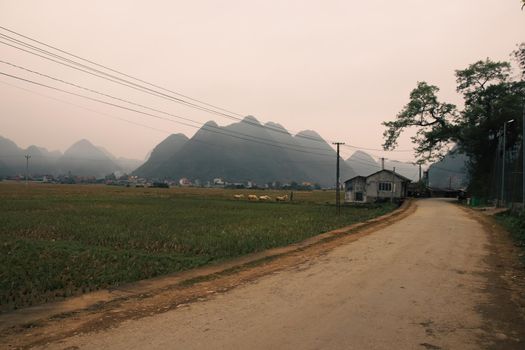 Cinematic scenery of fogs covering the karst mountains in rural Bac Son in Vietnam