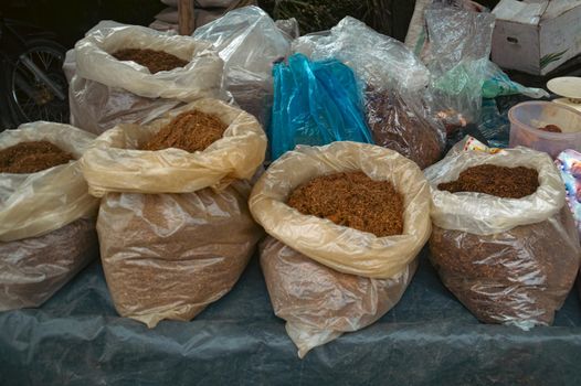 Bags full of tobacco fibers sold in the local market in Medan North Sumatra, Indonesia