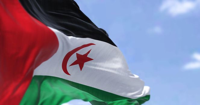 Detail of the national flag of Sahrawi Arab Democratic Republic waving in the wind on a clear day. Sahrawi Arab Democratic Republic is a partially recognized state located in the western Maghreb.