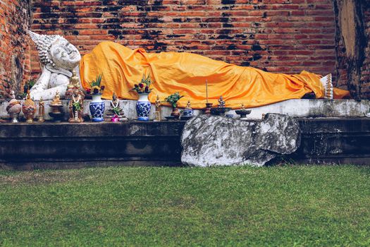 Reclining Buddha statue in Wat Yai Chai Mongkhol inside Ayutthaya Historical Park in Thailand