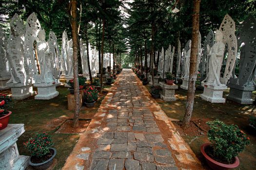 Rows of white Buddha statues in Linh An Tu Pagoda in Dalat, Vietnam