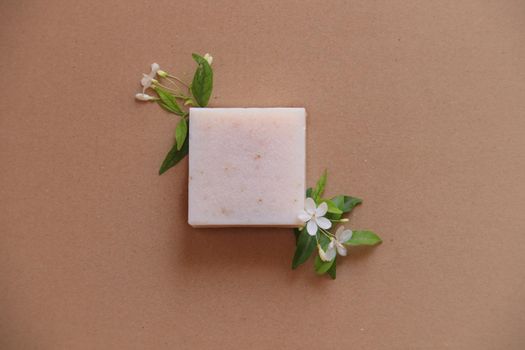 Flat lay of a handmade organic vegan soap showing the concept of sustainable comfort and Springtime